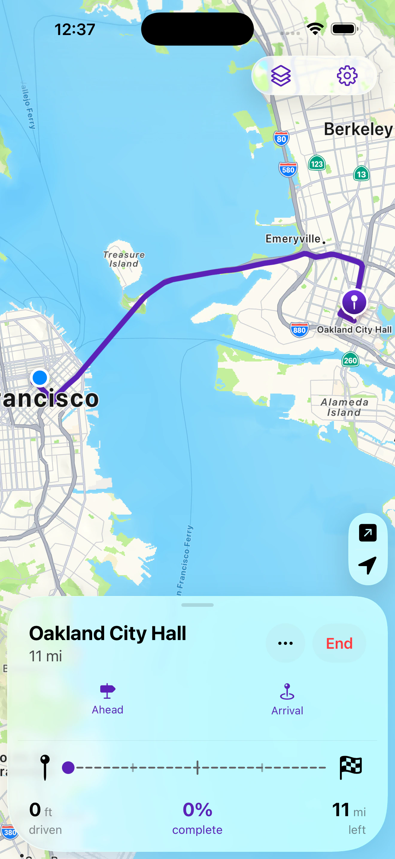 Headed showing a committed route from San Francisco to Oakland City Hall, with distance driven, percent complete, and distance remaining.