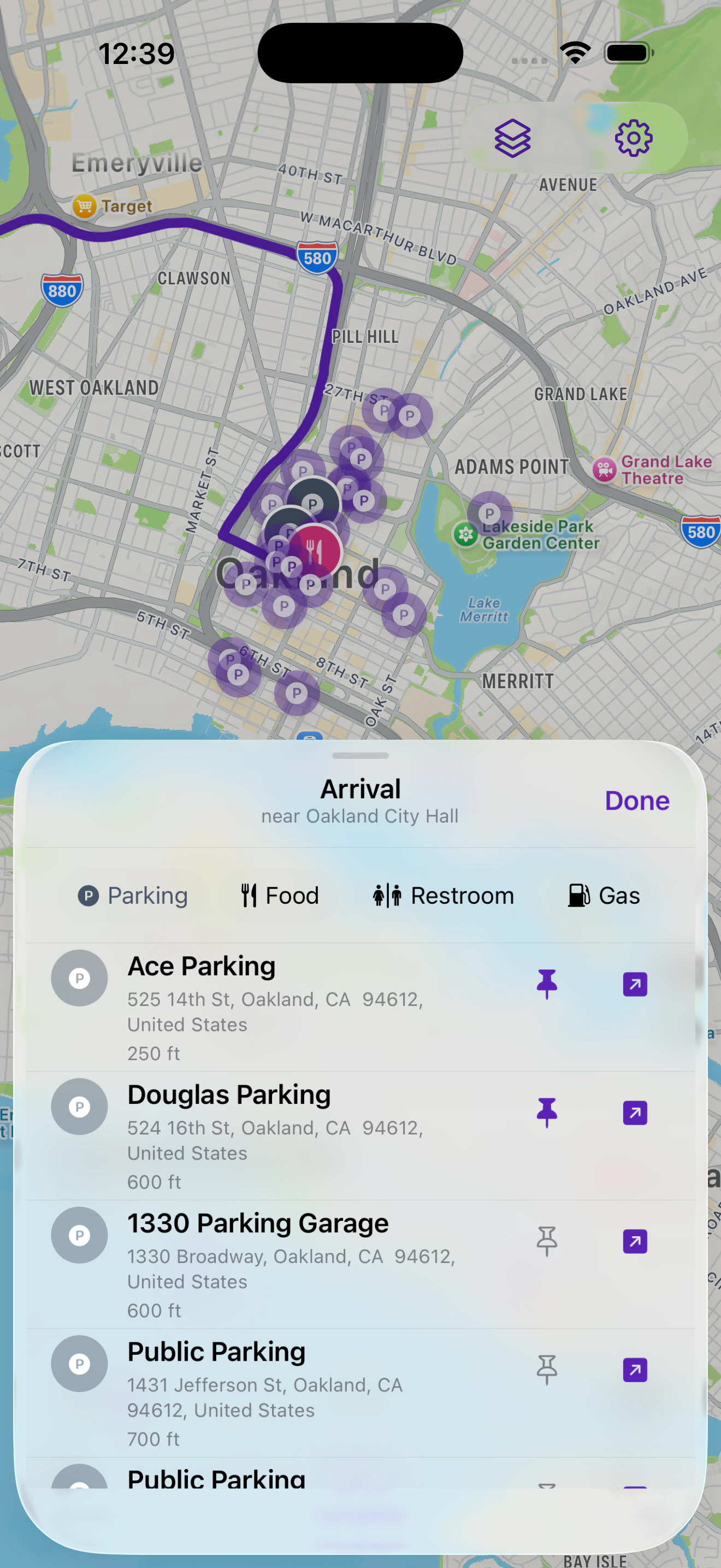 The Arrival sheet near Oakland City Hall, listing Ace Parking 250 feet away and Douglas Parking 600 feet away.