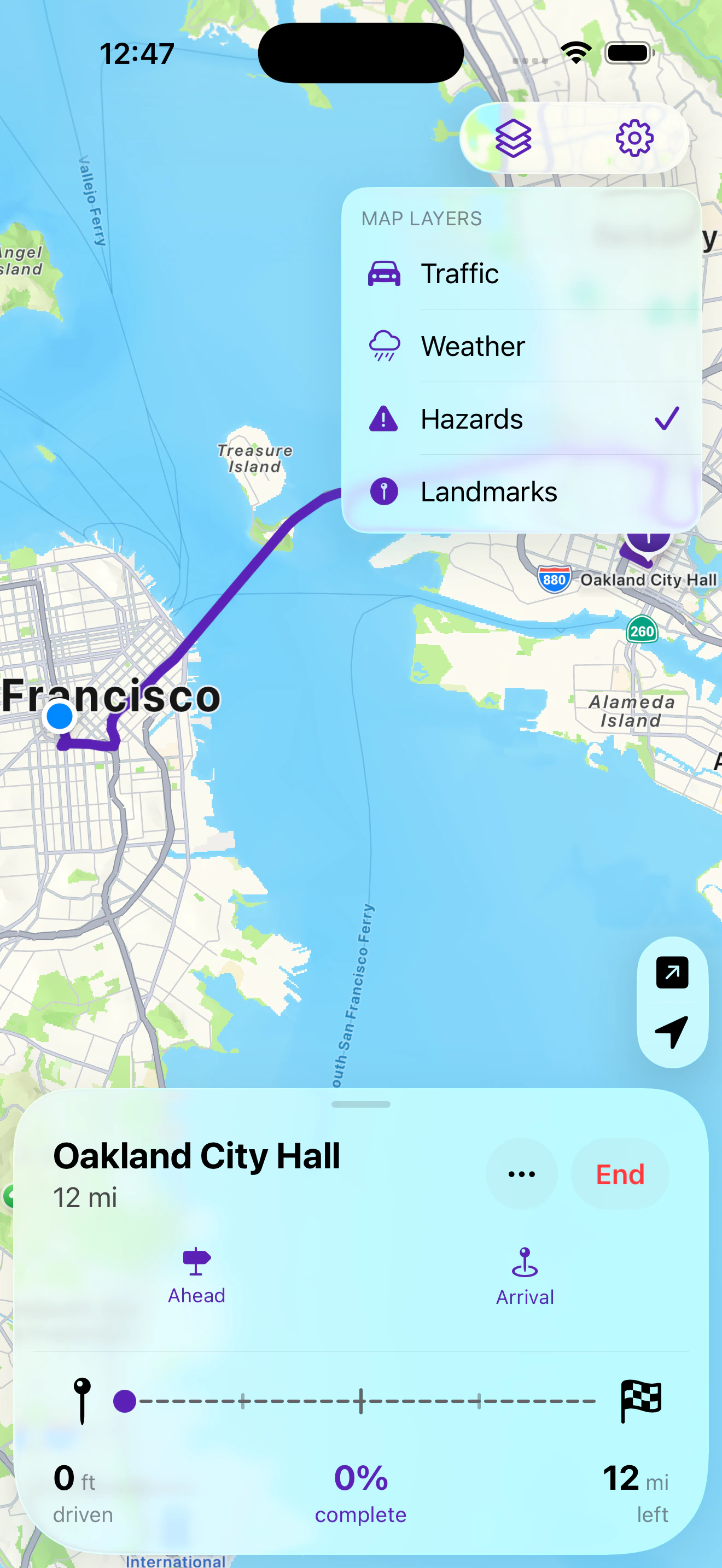 The Map Layers panel open over the route, listing Traffic, Weather, Hazards, and Landmarks.